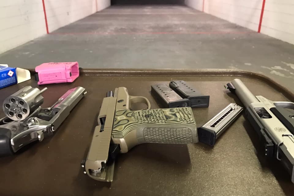 A gun that is laying on the table