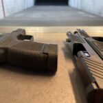 A gun that is sitting on the ground.