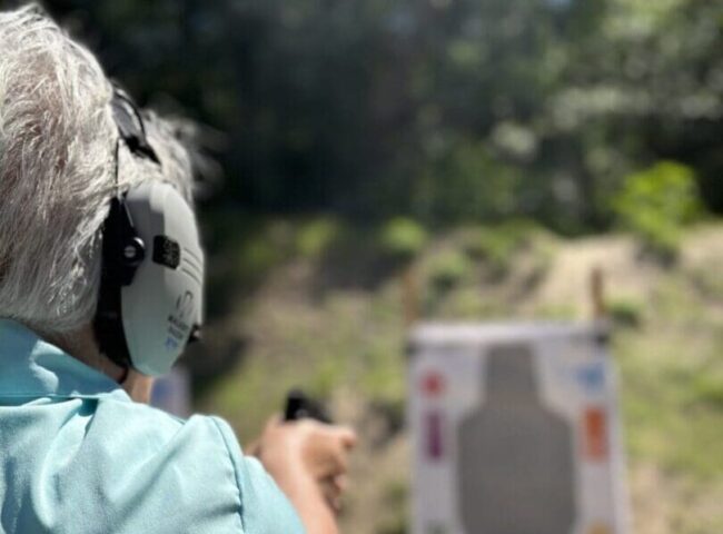 A person is shooting at an archery target.