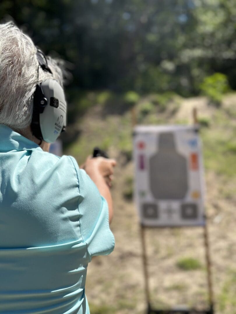 A person is shooting at an archery target.